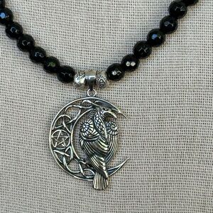 Silver and Black Beaded Necklace with Bird Pendant